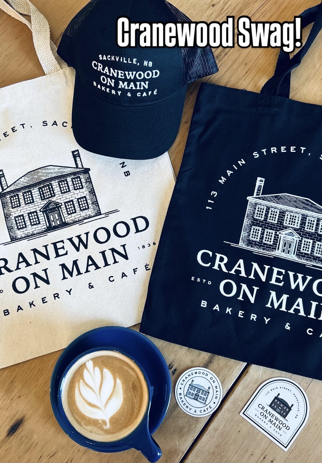 Cranewood merchandise — tote bags, hat, coffee and stickers